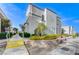 The building's exterior has colorful bushes and a retaining wall with flowers and plants surrounding it at 3150 Soft Breezes Dr # 2018, Las Vegas, NV 89128