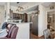 Open kitchen with stainless steel appliances and a breakfast bar at 3150 Soft Breezes Dr # 2018, Las Vegas, NV 89128