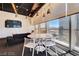 Bright living room features a modern sofa, round table, and expansive windows with city views at 3726 Las Vegas Blvd # 2605, Las Vegas, NV 89158