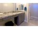 Bathroom featuring granite counters, vanity area, and a walk-in shower at 3921 Jacob Lake Cir, Las Vegas, NV 89118