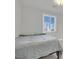 Bedroom featuring a bed with gray covers and a shuttered window at 3921 Jacob Lake Cir, Las Vegas, NV 89118
