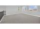 Spacious bonus room with plush carpeting and abundant natural light, offering a versatile space at 3921 Jacob Lake Cir, Las Vegas, NV 89118