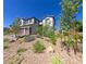 Beautiful, landscaped home with a three-car garage and well-maintained front yard at 3921 Jacob Lake Cir, Las Vegas, NV 89118