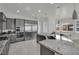 Gourmet kitchen with stainless steel appliances, granite countertops, and ample cabinet space at 3921 Jacob Lake Cir, Las Vegas, NV 89118