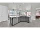 Bright, open kitchen with a breakfast bar, granite countertops, and modern appliances at 3921 Jacob Lake Cir, Las Vegas, NV 89118