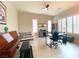 Versatile office space with ample natural light, a desk, and a comfortable seating area for a productive work environment at 3921 Jacob Lake Cir, Las Vegas, NV 89118