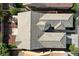 Birds-eye view of home showing entire roof, small front yard, and some surrounding property at 4137 Cackling Goose Dr, North Las Vegas, NV 89084