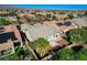 An aerial shot of the backyard, showcasing greenery, hardscape, and location within the neighborhood at 4137 Cackling Goose Dr, North Las Vegas, NV 89084