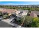 Aerial shot capturing the home's position in a quiet neighborhood with lush greenery at 4137 Cackling Goose Dr, North Las Vegas, NV 89084