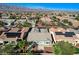 Wide aerial view of a neighborhood in Nevada, showcasing the home, community, and mountain range in the background at 4137 Cackling Goose Dr, North Las Vegas, NV 89084