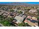 Wide aerial view of a neighborhood in Nevada, showcasing the home, community, and mountain range in the background at 4137 Cackling Goose Dr, North Las Vegas, NV 89084