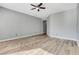 Bedroom with ceiling fan, recessed lighting, neutral walls, and wood floors offer a relaxing retreat at 4137 Cackling Goose Dr, North Las Vegas, NV 89084