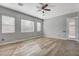Bedroom with three windows for natural light and wood-style floors at 4137 Cackling Goose Dr, North Las Vegas, NV 89084