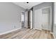 This bedroom features natural light, wood-look floors, and a closet across the room at 4137 Cackling Goose Dr, North Las Vegas, NV 89084