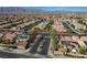 Wide aerial view of a neighborhood in Nevada, showcasing the community and a mountain range in the background at 4137 Cackling Goose Dr, North Las Vegas, NV 89084