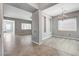Spacious dining area featuring tile and hardwood flooring, chandelier, and neutral paint at 4137 Cackling Goose Dr, North Las Vegas, NV 89084
