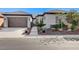 Charming single story home showcasing a two car garage, and attractive desert landscaping at 4137 Cackling Goose Dr, North Las Vegas, NV 89084
