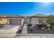 Charming single-story home with a two-car garage, walkway, and well-maintained front yard at 4137 Cackling Goose Dr, North Las Vegas, NV 89084