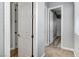 Hallway with neutral walls, baseboards, and multiple doorways leading to other parts of the home at 4137 Cackling Goose Dr, North Las Vegas, NV 89084