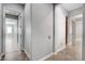 Hallway connecting different areas of the home, showcasing tile flooring and neutral tones at 4137 Cackling Goose Dr, North Las Vegas, NV 89084
