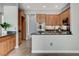 Kitchen with wood cabinets, stainless steel appliances, and granite countertops at 4137 Cackling Goose Dr, North Las Vegas, NV 89084