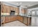 Open kitchen with stainless steel appliances, granite counters, and access to the living area at 4137 Cackling Goose Dr, North Las Vegas, NV 89084