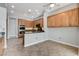 Open kitchen with stainless steel appliances and wood cabinetry at 4137 Cackling Goose Dr, North Las Vegas, NV 89084