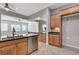 Spacious kitchen featuring an island with a sink, stainless steel dishwasher, and ample storage at 4137 Cackling Goose Dr, North Las Vegas, NV 89084