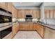 Well-equipped kitchen showcasing stainless steel appliances and generous granite countertops at 4137 Cackling Goose Dr, North Las Vegas, NV 89084