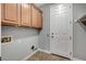 Dedicated laundry room with storage cabinets, a door to the outside, and easy access at 4137 Cackling Goose Dr, North Las Vegas, NV 89084