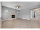 Open living room featuring tile floors, fireplace, and neutral wall color scheme at 4137 Cackling Goose Dr, North Las Vegas, NV 89084