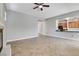 Open living room featuring tile floors, fireplace, and view into the kitchen at 4137 Cackling Goose Dr, North Las Vegas, NV 89084