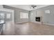 Open living room featuring tile floors, fireplace, and neutral wall color scheme at 4137 Cackling Goose Dr, North Las Vegas, NV 89084