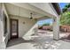 Covered patio offers outdoor living space with ceiling fan and access to the landscaped backyard at 4137 Cackling Goose Dr, North Las Vegas, NV 89084