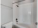 Clean bathroom shower features white tiles, matte black hardware, and a shower head at 4137 Cackling Goose Dr, North Las Vegas, NV 89084