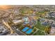 Sweeping aerial view of the community, highlighting the pool, tennis courts, and golf course at 437 Via Stretto Ave, Henderson, NV 89011