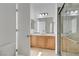Bathroom features a stylish vanity, modern fixtures, and a glass-enclosed shower for a luxurious feel at 437 Via Stretto Ave, Henderson, NV 89011