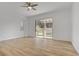 Sunlit bedroom with wood floors and backyard view at 437 Via Stretto Ave, Henderson, NV 89011