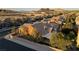 An exterior view shows the desert landscaping and well-maintained facade in a vibrant neighborhood at 437 Via Stretto Ave, Henderson, NV 89011