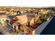 View showcasing the facade with desert landscaping, palm trees, and a privacy wall at 437 Via Stretto Ave, Henderson, NV 89011