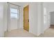 Bright foyer featuring neutral walls, light tile flooring, a wooden front door, and natural light at 437 Via Stretto Ave, Henderson, NV 89011