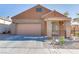 Welcoming single-story home with a two-car garage, desert landscaping, and a covered porch at 437 Via Stretto Ave, Henderson, NV 89011