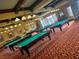 Bright game room featuring multiple billiard tables with ample space for recreational activities at 437 Via Stretto Ave, Henderson, NV 89011