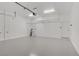 This garage features a painted concrete floor, an overhead storage rack, and an automatic door opener at 437 Via Stretto Ave, Henderson, NV 89011