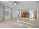 Bright living room with tile flooring connecting to the kitchen area at 437 Via Stretto Ave, Henderson, NV 89011