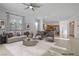 Comfortable living room with open layout, stylish furniture, and adjacent kitchen at 437 Via Stretto Ave, Henderson, NV 89011