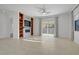 Spacious living room with a modern entertainment center and access to the backyard at 437 Via Stretto Ave, Henderson, NV 89011