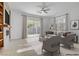 Cozy living room with a sliding glass door leading to the backyard, stylish seating at 437 Via Stretto Ave, Henderson, NV 89011