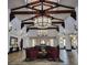 Beautifully designed lobby with high ceilings, wood beams, and comfortable seating arrangements at 437 Via Stretto Ave, Henderson, NV 89011