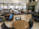 Spacious lobby with comfortable seating areas, stone fireplace, and elegant lighting fixtures at 437 Via Stretto Ave, Henderson, NV 89011